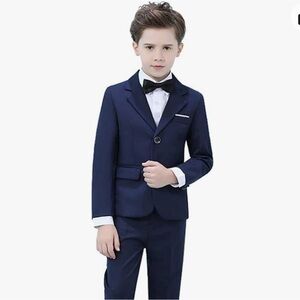 Boys suit, size 8. Tags still on! Includes jacket, pants, bow tie and shirt.